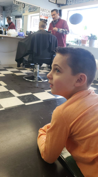 Inside Royal Barber Shop with barbers at work